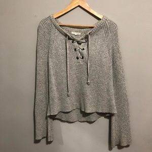 Grey knit long sleeve sweater with flare sleeves with tied detailing